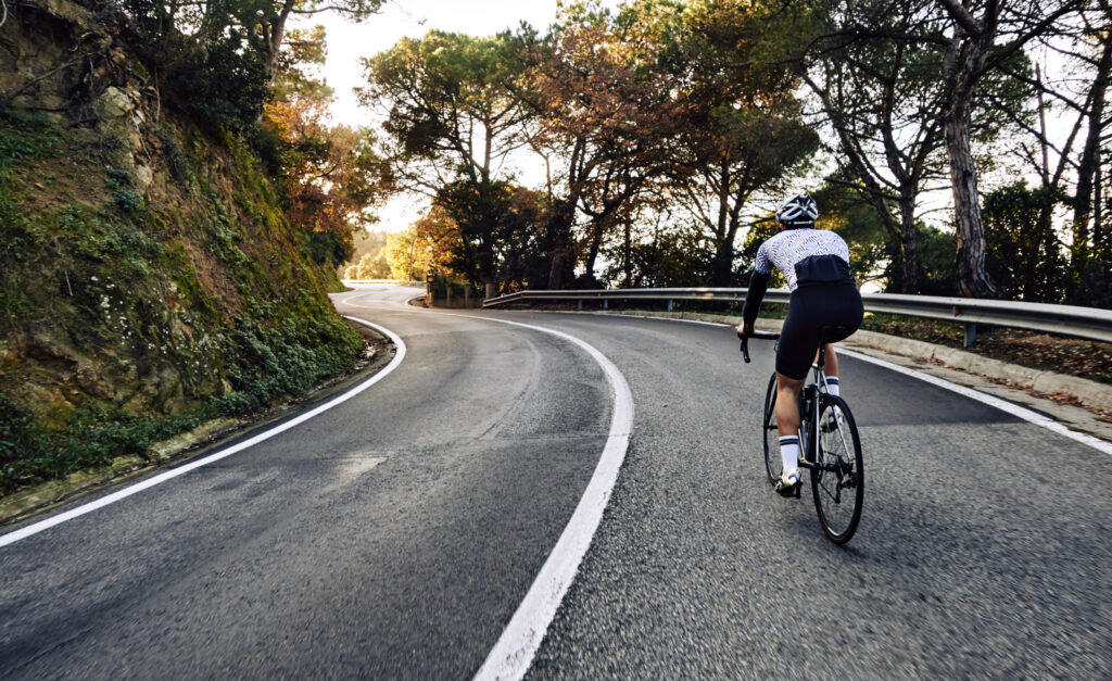 cyclist man riding bike road scaled 1